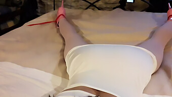 Laura'S Form-Fitting White Dress And Pink Pantyhose Accentuate Her Slender Figure As She Is Bound And Silenced On The Bed, Clad In High Heels.